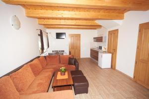 a living room with a couch and a table at U Haryho in Dolní Bečva