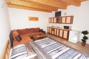 a living room with two beds and a couch at U Haryho in Dolní Bečva