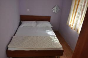 Posteľ alebo postele v izbe v ubytovaní Apartments with parking spaces Lopar, Rab - 16680
