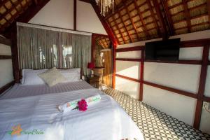 سرير أو أسرّة في غرفة في Sao Biển Cam Ranh - Starfish Cam Ranh