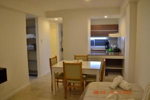 a dining room and kitchen with a table and chairs at TERAPIA DIVINA in Saladillo
