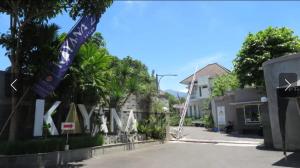 a street with a sign in front of a building at Villa Kayana EE6 - 3 Bedrooms in Batu