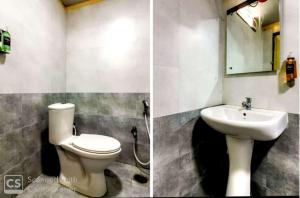 a bathroom with a toilet and a sink at HOTEL SRIRAMA INN in Gachibowli