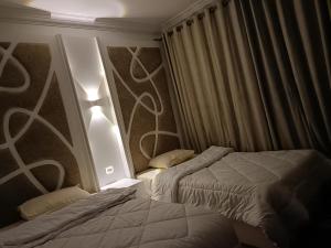 Tempat tidur dalam kamar di Sheraton ocean 603 - Private apartments