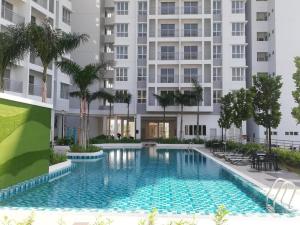 an image of a swimming pool in front of a building at PalamStay in Kuala Selangor