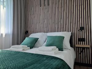 Posteľ alebo postele v izbe v ubytovaní Apartament Zamkowe Wzgórze