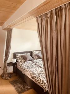 a bed with a canopy in a room at Ferienwohnung Zu den Weinbergen in Zeil