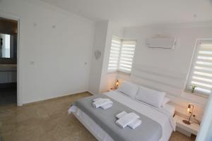 Postel nebo postele na pokoji v ubytování Villa Butterfly Rent a villa Fethiye