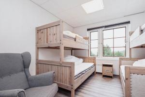 Postel nebo postele na pokoji v ubytování Basecamp Frich`s Hjerkinn