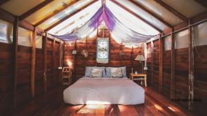 Letto o letti in una camera di THE RIVER RUNS CHIANG KLANG
