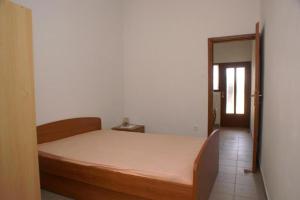 Postel nebo postele na pokoji v ubytování Apartmani Lorena