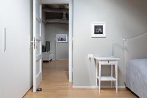 A bed or beds in a room at Tribunali suite de charme