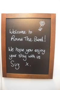 a chalkboard with a sign in a wooden frame at Round The Bend, an annexe in the quiet village of Odcombe in Montacute