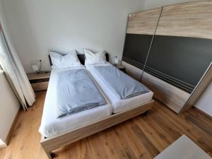a bedroom with a bed and a chalkboard at Alpine Kitz in Hollersbach im Pinzgau