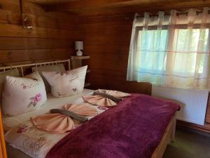 Ein Bett oder Betten in einem Zimmer der Unterkunft Naturpark Kanone