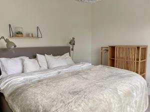 Un pat sau paturi într-o cameră la Åre Travel - VM huset