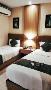 Postel nebo postele na pokoji v ubytování Hotel West Blue