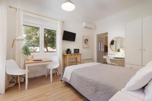 Posteľ alebo postele v izbe v ubytovaní Aloe Apartments