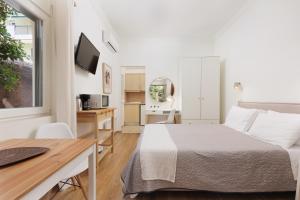 Televízia a/alebo spoločenská miestnosť v ubytovaní Aloe Apartments