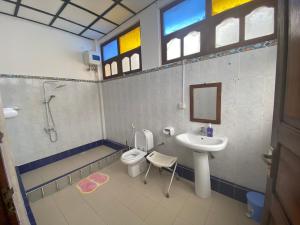 a bathroom with a sink and a toilet and a sink at Stone town sea view in Zanzibar City