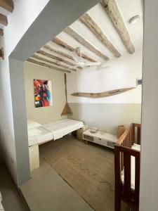 Postel nebo postele na pokoji v ubytování Zanzibar Tiny Villa at La Villa De Victor