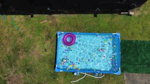 an aerial view of a playset in the grass at Calle Hollanda 3 Bedroom Home in San Juan