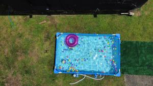 an aerial view of a play table in the grass at Calle Hollanda 3 Bedroom Home in San Juan