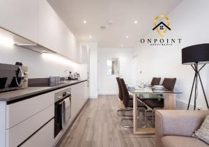 a kitchen and dining room with a table and chairs at ✰OnPoint - Fantastic 1 Bedroom Apt with PARKING✰ in Reading