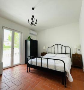 Postel nebo postele na pokoji v ubytování Il Casale dei Calanchi