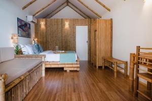 Voodi või voodid majutusasutuse Ecoboo Maldives toas