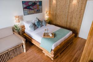 Voodi või voodid majutusasutuse Ecoboo Maldives toas