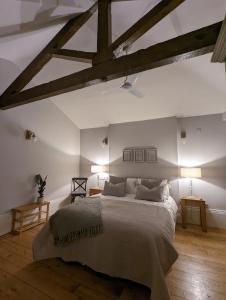 a bedroom with a large bed and wooden floors at Banks Bed & Continental Breakfast in Minster