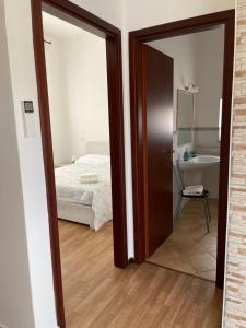 A bed or beds in a room at Casa Azzurra