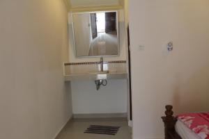 a bathroom with a sink and a mirror at Karma House in Ubud +87 photos