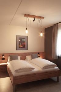 Postel nebo postele na pokoji v ubytování Hotel Restaurant Tychon AG
