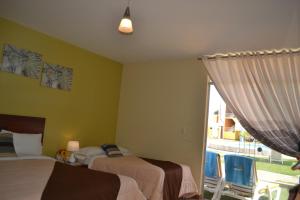 Postel nebo postele na pokoji v ubytování Kajaca Suite Hotel