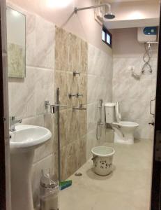 a bathroom with a shower and a toilet and a sink at ALL SEASONS HOTEL in Gangtok