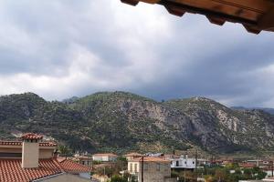 a view of a mountain range with houses and buildings at An Entire studio- Farida-Free Parking-Wifi in Xirokámbion