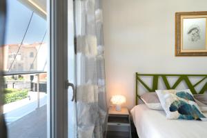 Postel nebo postele na pokoji v ubytování [NEW LOANO] Elegante ☆☆☆☆☆ a 150 mt dal mare