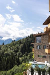 a house with a view of a mountain at Puitalm - Natur I Apart I Hotel in Arzl im Pitztal