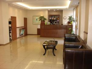 a lobby with a couch and a coffee table at Hotel Berezka in Vyshny Volochyok