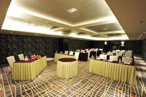 a banquet hall with tables and chairs in a room at Ming Garden Hotel in Kota Kinabalu