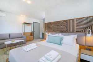 Elisavet Nuevo Studios & Suites客房内的一张或多张床位