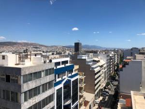 an aerial view of a city with buildings at ROYAL RED SUITE NO 1, PIRAEUS PORT in Piraeus