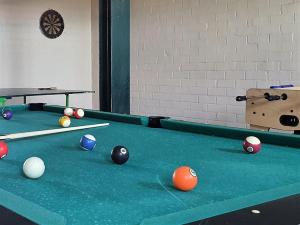 a pool table with balls on top of it at Vakantiehoeve Walleboom in Lo-Reninge