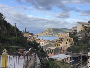 a town on a hill with a view of the water at Camere Giuliano basso in Vernazza