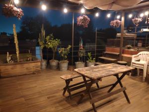 a wooden table in a room with potted plants at Calle Berlin Boutique in Mexico City