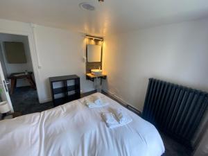 Letto o letti in una camera di RestAuberge La Reine Meije