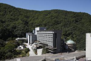 an aerial view of a building in front of a mountain at Noboribetsu Grand Hotel in Noboribetsu