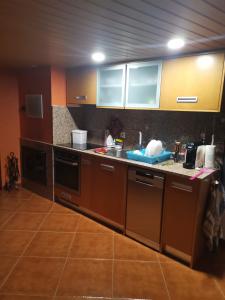 a kitchen with a sink and a counter top at Casa da Gracita in Pereira